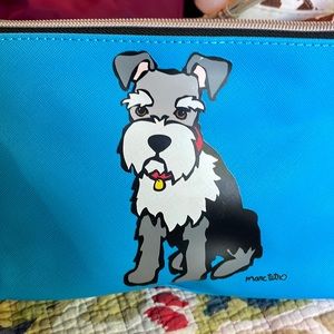 Cute medium sized cosmetic bag. Adorable dog outside and stripes on the inside.